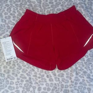 Lululemon hotty hot 4 inch shorts in dark red color